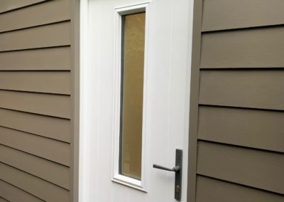 Grey Cladding And External Side Door